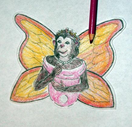 Chimpanzee Button Fairy colored Shrinky Dink.