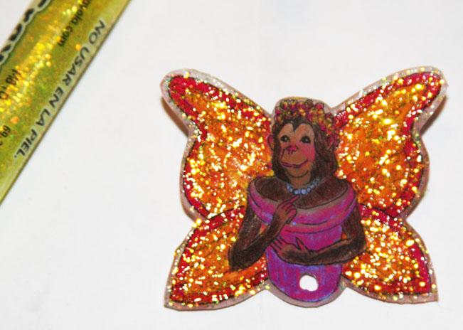 Glitter glue on Chimpanzee Fairy Butterfly wings.