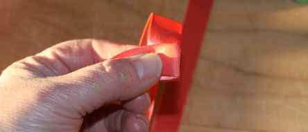Fold satin ribbon to make rose flowerpen.