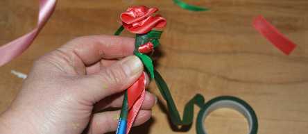 Add rosebud to ribbon flowerpen.