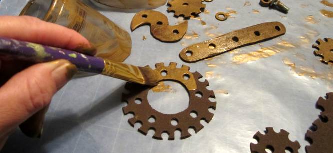 Craft paint gears for steampunk hat. 