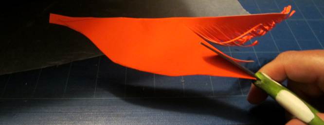 Fold and cut cardstock to feather shape. 